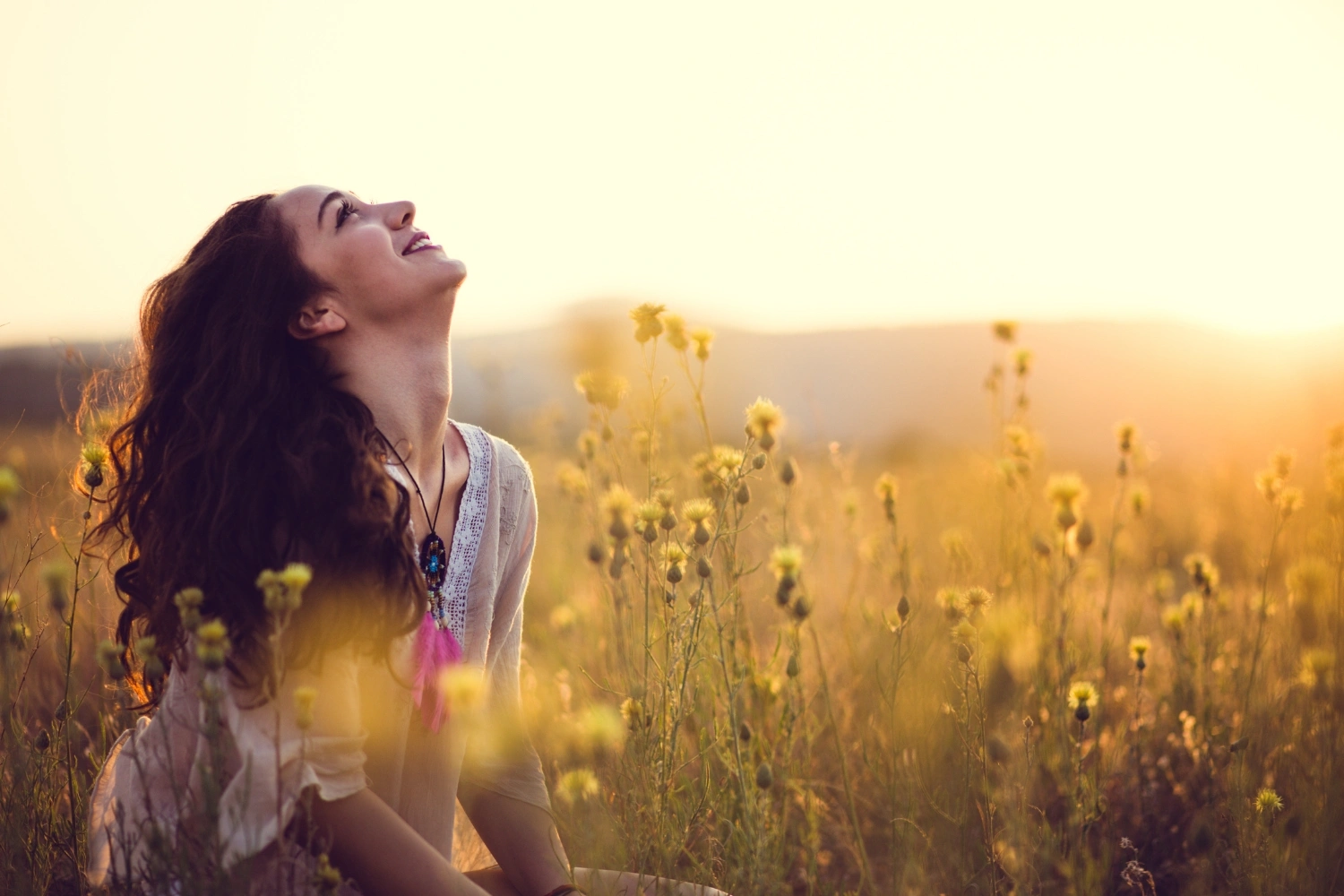 woman happy in grass
