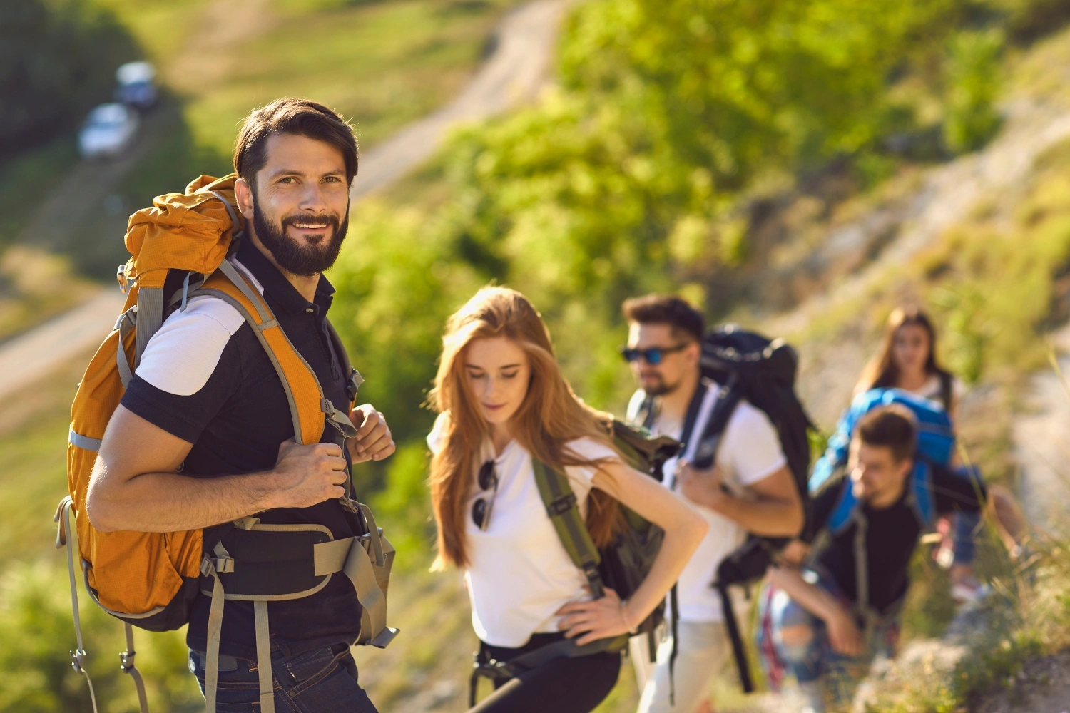 group of happy people hiking