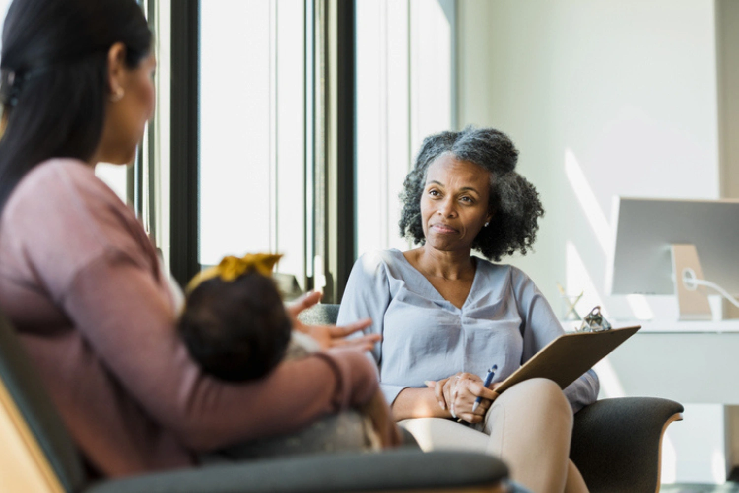therapist and woman with her child